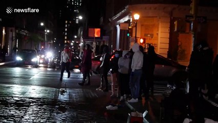 Chaotic scenes in SoHo area of NYC as looters nearly run over pedestrians