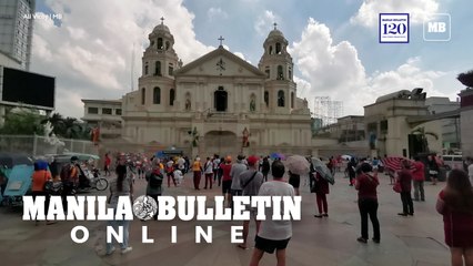 Faithfuls pray outside the Quiapo Church in Manila on the first Friday of the month under GCQ