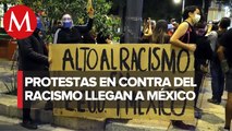 Con carteles y veladoras, protestan contra el racismo en embajada de EU en México