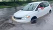 Driver attempts to head down flooded road