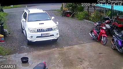 Moped Crashes into Garage