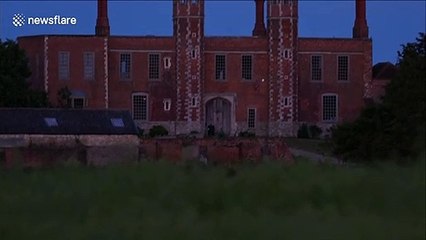 Spectacular 'strawberry' full moon rises over historic UK church