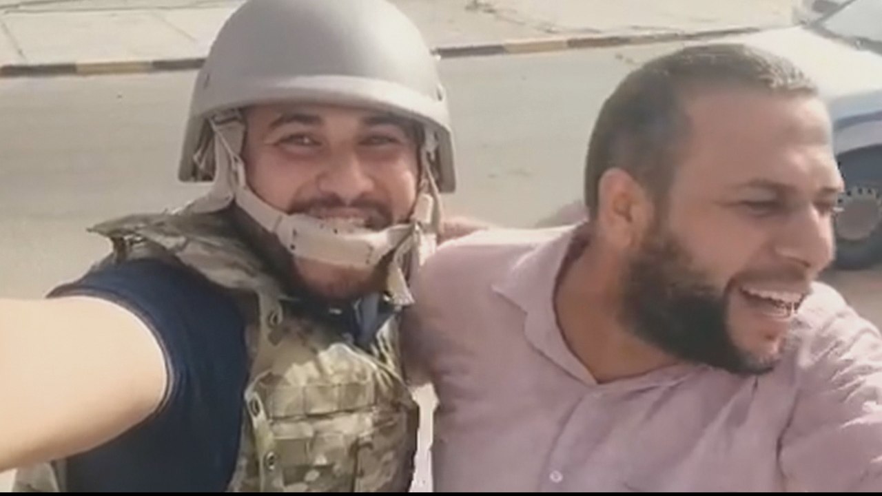 Libyans celebrate after gov't retakes key city near Tripoli