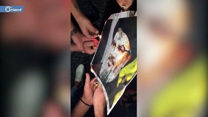 محتجون يحرقون صورة زعيم ميليشيا حزب الله