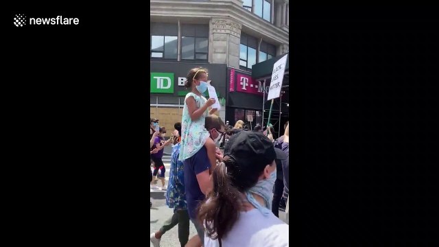 Little girl leads the No justice, no peace! chants during protest in New York