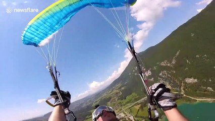 French paraglider undergoes intense 'simulated flight incident' course above lake