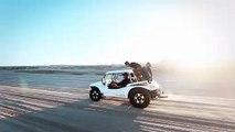 Two Vehicles Traveling In The Desert