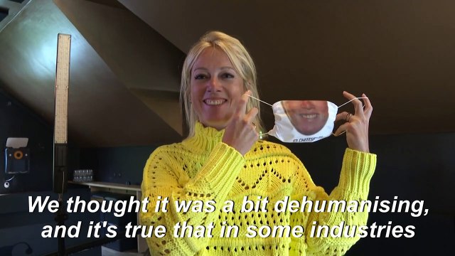 Service with a (fake) smile: Brussels restaurant staff wear masks with their faces printed on