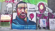 George Floyd mural painted on West Bank barrier