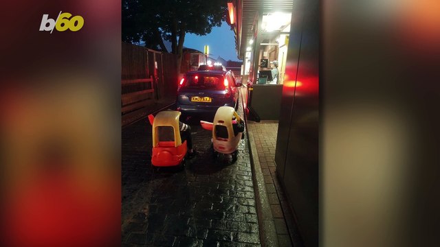 Two Little Girls Awkwardly Drive Toy Cars to Pick Up McDonalds Drive Thru