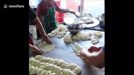 Watch how this Malaysian market stall fries bubble-like flatbread with ease