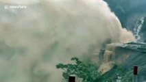 Water bursts out of penstock after it is broken by landslide at Chinese hydropower station