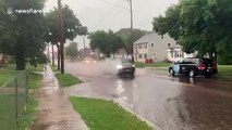 Flash flooding in Sioux Falls, South Dakota as heavy rain floods street amid intense storms