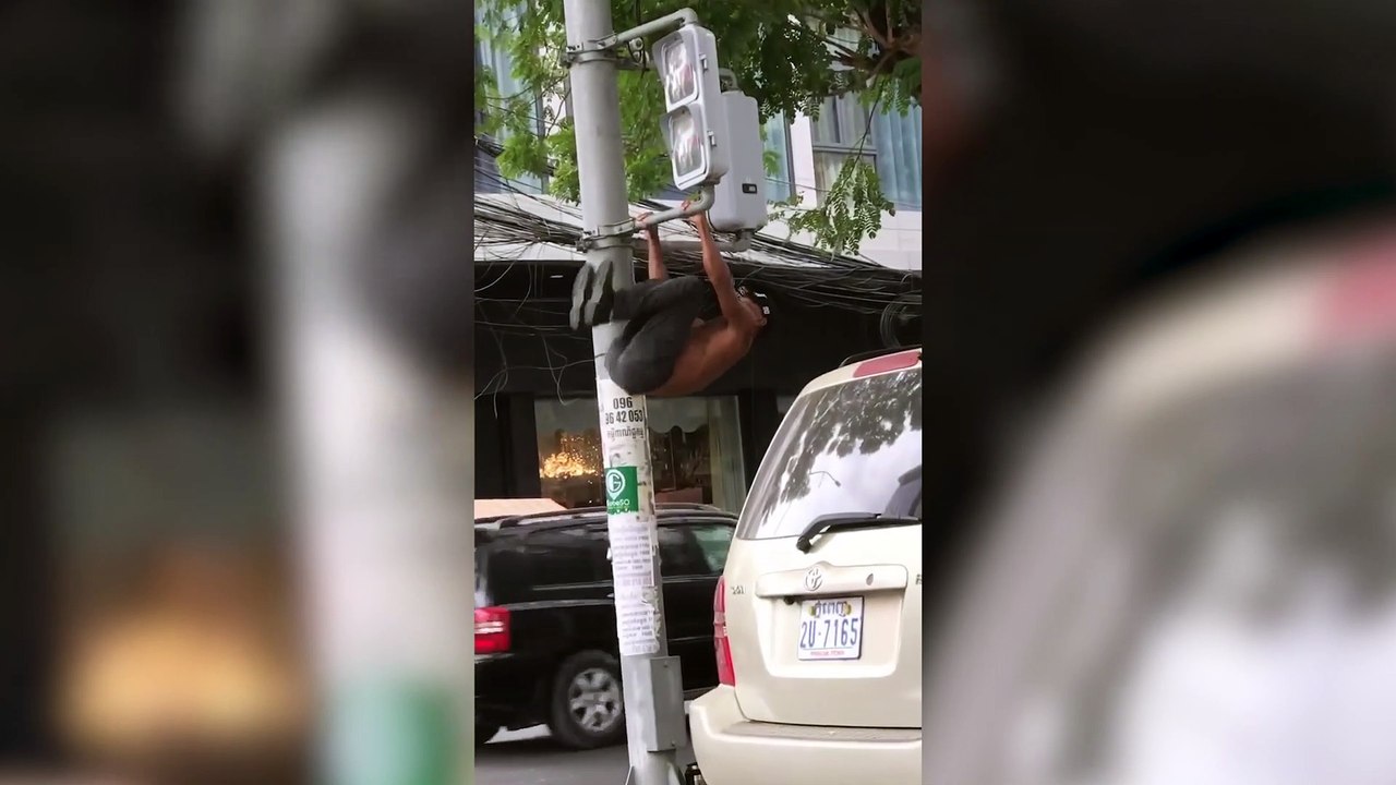 Gym Bunny Does Pull Ups On Traffic Light