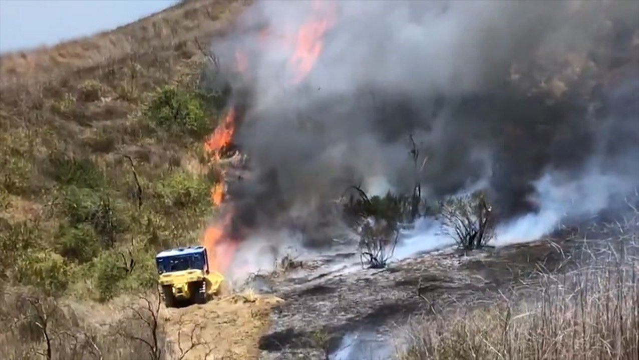 Firefighters battle wildfires in California