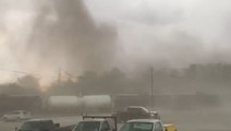 Possible tornado barrels through parking lot