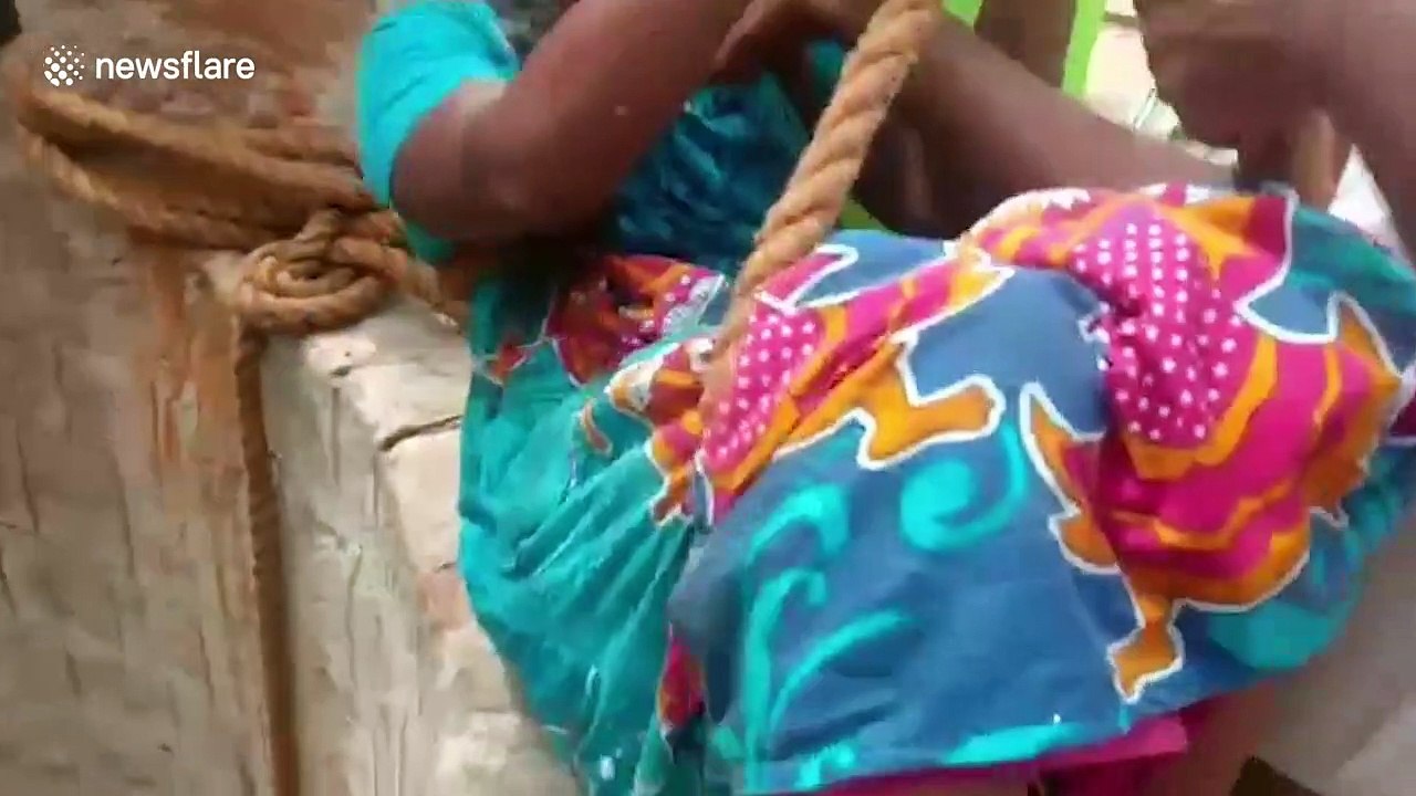 Dramatic moment fire brigade rescues woman from 60-foot-well in southern India