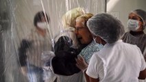 ‘Hug curtain' allows elderly safe cuddles from Covid-19 isolation at Brazil nursing home