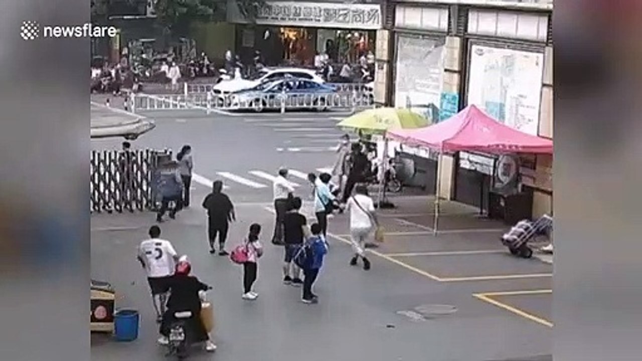 Brave elderly Chinese man trips suspect fleeing from police
