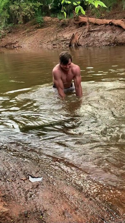 Man Catches Enormous Fish with his Bare Hands