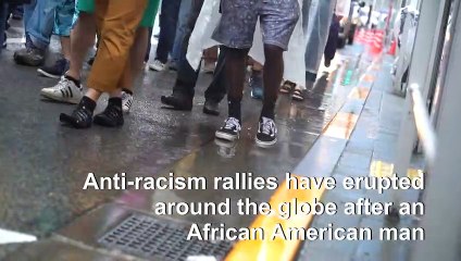 Black Lives Matter supporters brave the rain in Tokyo