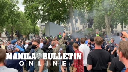 Thousands gather in London to 'guard' Churchill statue