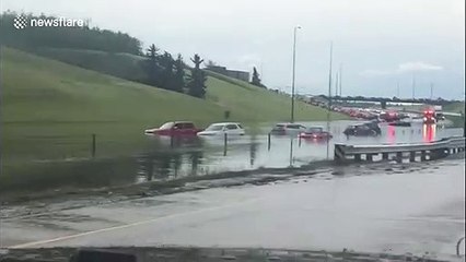 Download Video: Flash flooding hits Calgary in Canada after tornadoes touch down