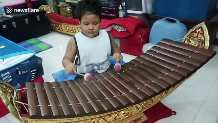 Talented five-year-old boy plays traditional Thai xylophone