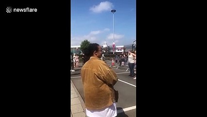 NHS workers wait in line as Sports Direct offers 50 percent off today as stores reopen