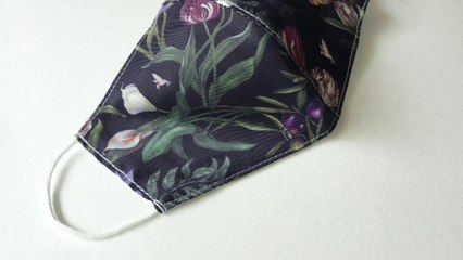 Face mask with water repellent non-toxic coating