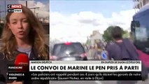 Regardez le convoi de Marine Le Pen pris à parti ce soir à Dijon alors qu'elle quitte la salle dans laquelle elle vient de faire sa conférence de presse