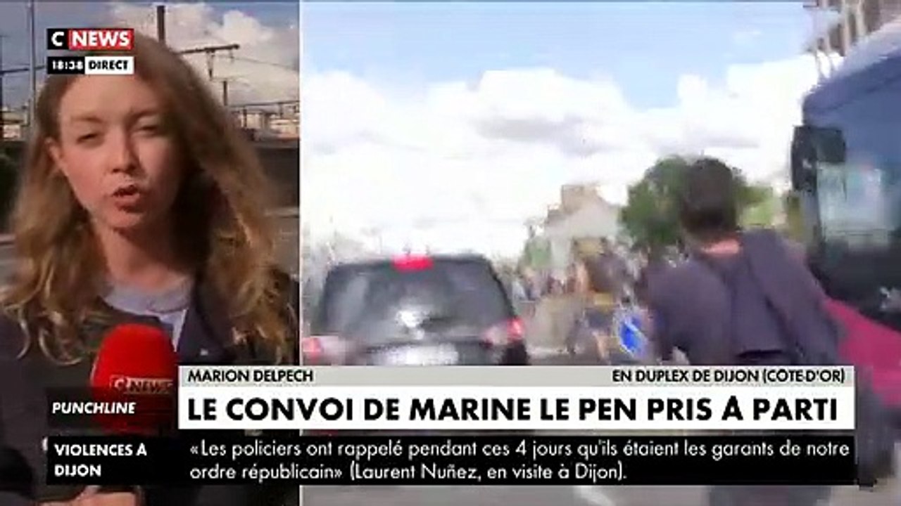 Regardez le convoi de Marine Le Pen pris à parti ce soir à Dijon alors qu'elle quitte la salle dans laquelle elle vient de faire sa conférence de presse