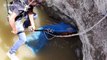 Rescuer struggles to save drowning dog from 70-feet deep well in western India