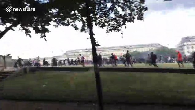 Police targeted by barrage of projectiles during clashes in Paris