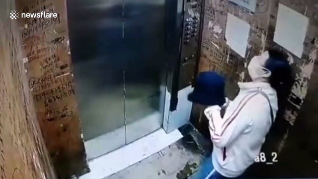 Disgusting moment Chinese woman spits on elevator buttons