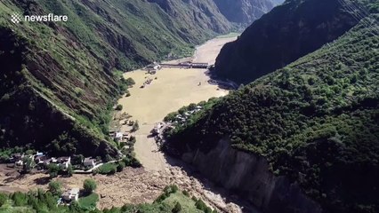 Natural barrier lake breaches dam submerging southern Chinese villages