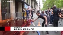 Extinction Rebellion sprays Medef employers' association HQ in Paris with fake blood