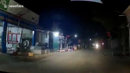 Driver has very close call in Vietnam as young child runs out in front of car at night