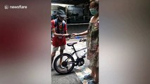 Kind shop owner gives free bike to struggling pensioner in the Philippines
