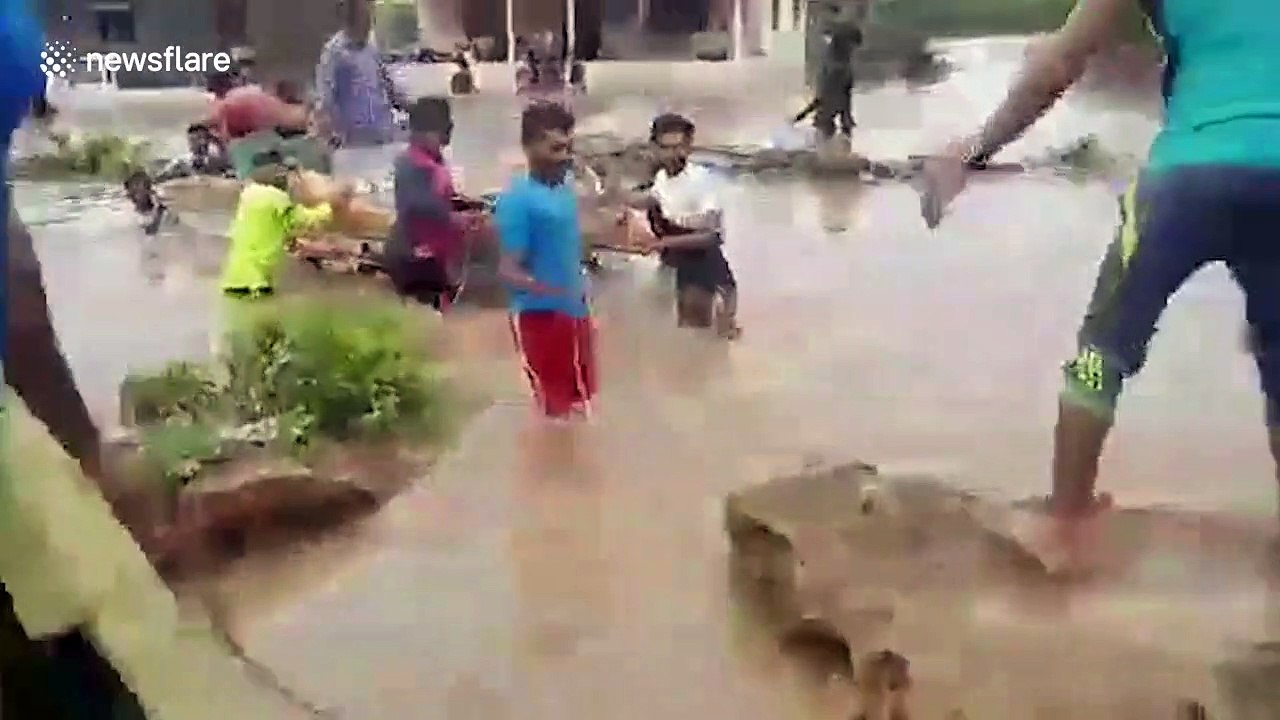 Stranded villagers rescued after check dam overflows in western India