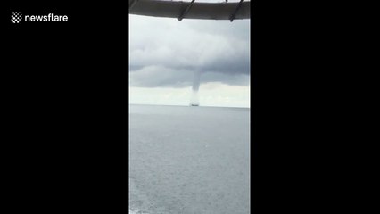 Large tornado passes between ships in Indonesia