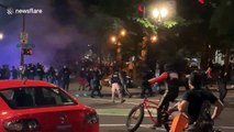 Tense scenes as anti-racism protesters in Portland shoot fireworks at police