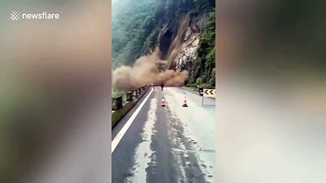 Dramatic landslide crashes down just in front of motorists in northern China