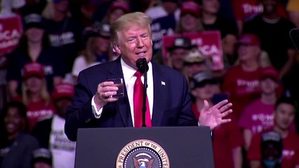 Trump defends pandemic response at rally