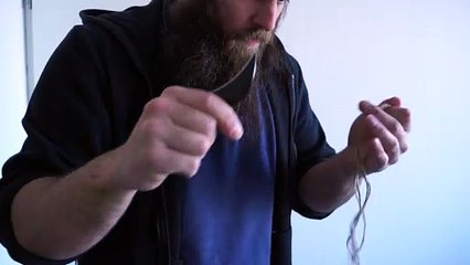 Cutting pieces of rope using a karambit blade piece 2