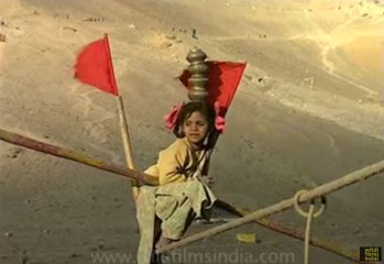 Kid performs dangerous tight rope walk, in the Himalaya