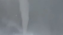 Landspout touches down amid storms