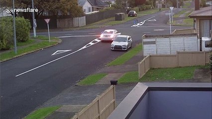 BMW travelling on wrong side of the road crashes car into an oncoming van in New Zealand