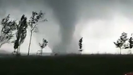 Large waterspout churns through lake