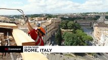 Rope-climbing workers help restore Rome landmark